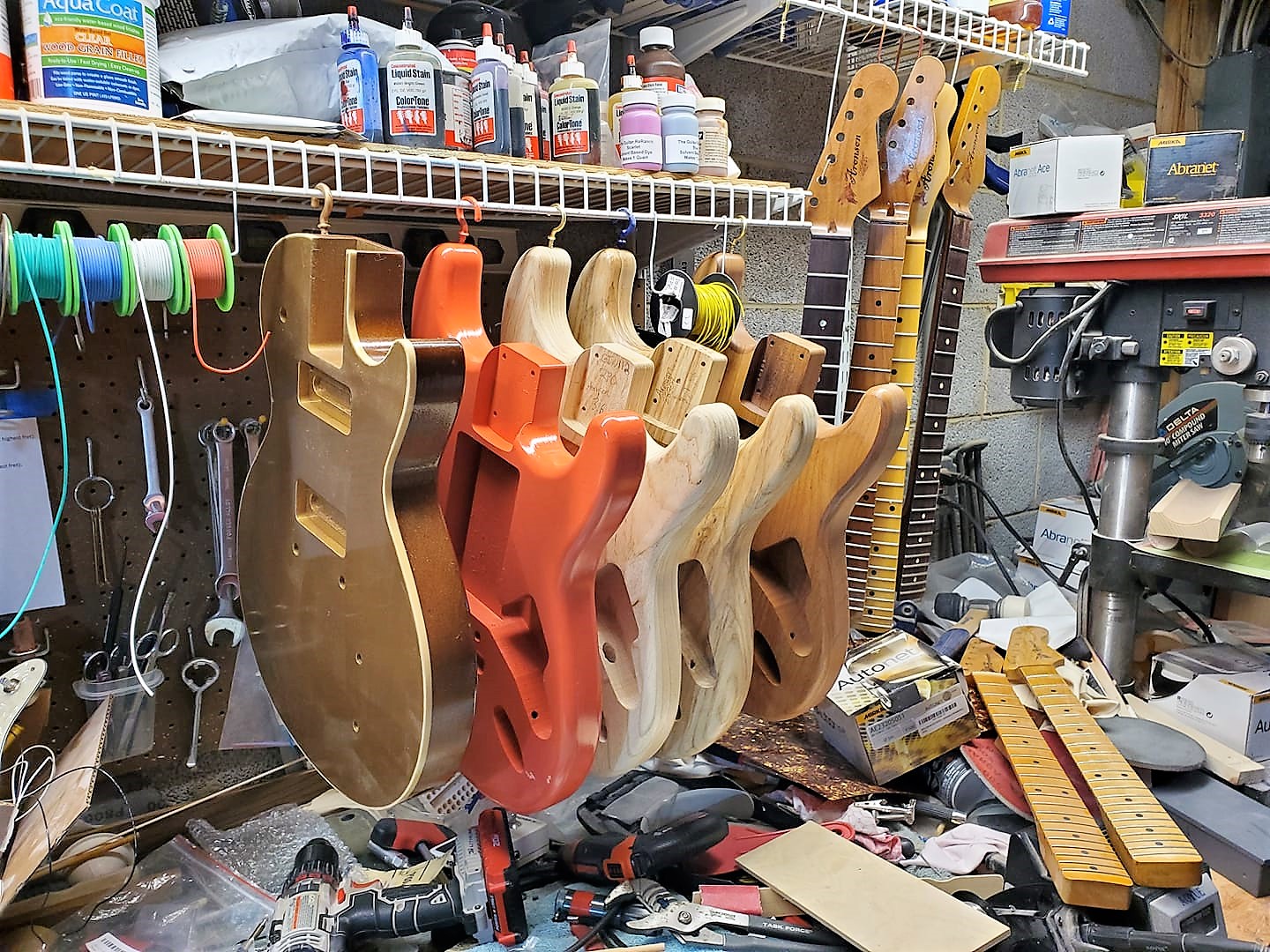 Mike Aronson's work bench with guitar bodies and guitar parts
